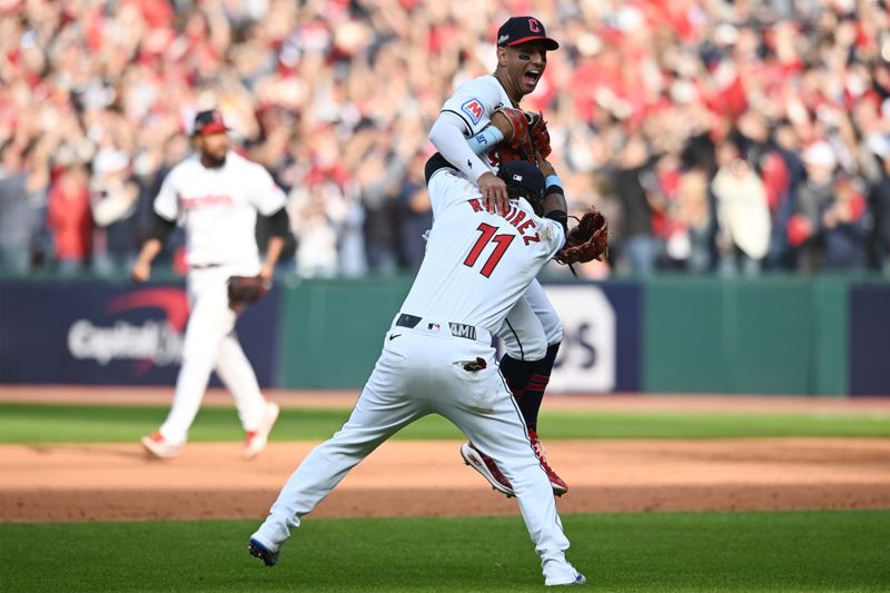 Oct 12, 2024; Cleveland, Ohio, USA; Cleveland Guardians third base José Ramírez (11) celebrates with shortstop Brayan Rocchio (4) after defeating the Detroit Tigers during game five of the ALDS for the 2024 MLB Playoffs at Progressive Field. Mandatory Credit: Ken Blaze-Imagn Images