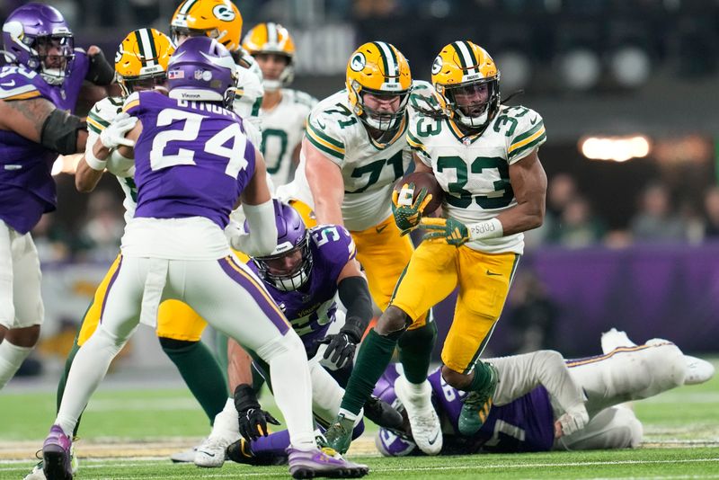 Green Bay Packers' Aaron Jones runs during the second half of an NFL football game against the Minnesota Vikings Sunday, Dec. 31, 2023, in Minneapolis. (AP Photo/Abbie Parr)