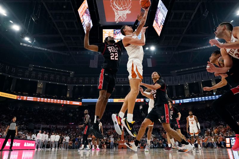 Jan 6, 2024; Austin, Texas, USA; Texas Longhorns forward Kadin Shedrick (5) shoots around Texas Tech Red Raiders forward Warren Washington (22) during the second half at Moody Center. Mandatory Credit: Scott Wachter-USA TODAY Sports