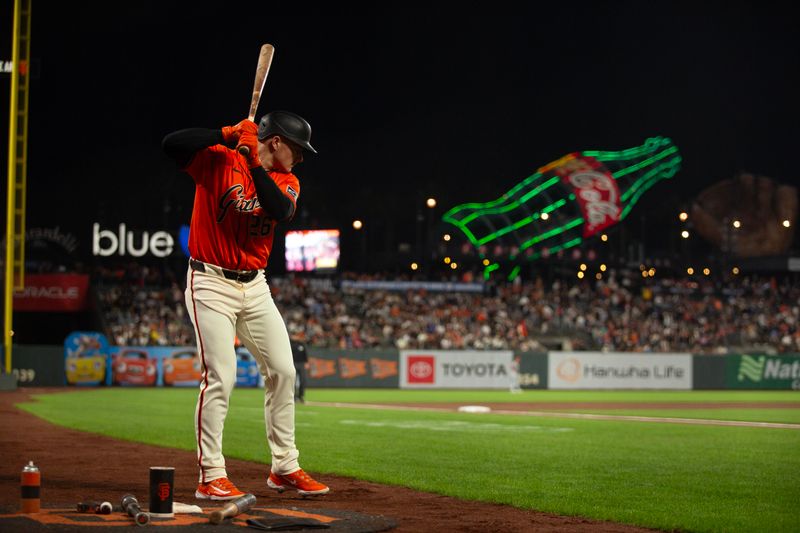 Sep 27, 2024; San Francisco, California, USA; San Francisco Giants third baseman Matt Chapman (26) awaits his turn at bat against the St. Louis Cardinals during the first inning at Oracle Park. Mandatory Credit: D. Ross Cameron-Imagn Images