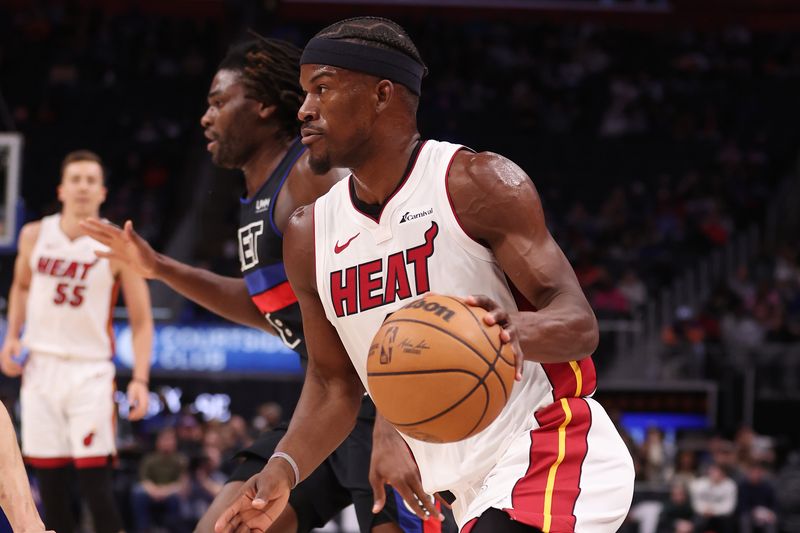 DETROIT, MICHIGAN - MARCH 15: Jimmy Butler #22 of the Miami Heat drives around Isaiah Stewart #28 of the Detroit Pistons during the first half at Little Caesars Arena on March 15, 2024 in Detroit, Michigan. NOTE TO USER: User expressly acknowledges and agrees that, by downloading and or using this photograph, User is consenting to the terms and conditions of the Getty Images License.  (Photo by Gregory Shamus/Getty Images)