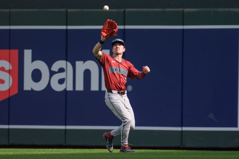 Sep 14, 2025; Minneapolis, Minnesota, USA; Arizona Diamondbacks right fielder Corbin Carroll (7) catches a fly ball hit by Minnesota Twins first base Kody Clemens (18) in the eighth inning at Target Field. Mandatory Credit: Matt Blewett-Imagn Images
