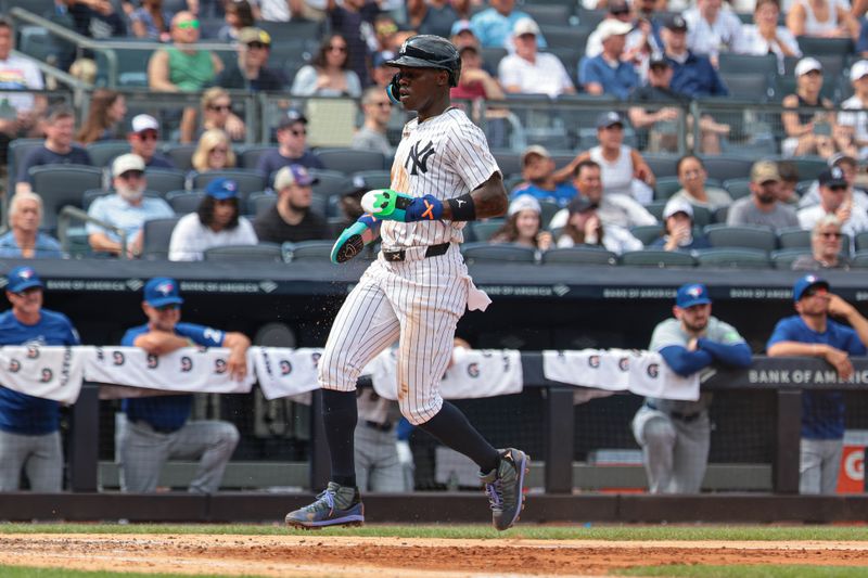 Aug 4, 2024; Bronx, New York, USA; New York Yankees third baseman Jazz Chisholm Jr. (13) scores a run during the sixth inning against the Toronto Blue Jays at Yankee Stadium. Mandatory Credit: Vincent Carchietta-USA TODAY Sports