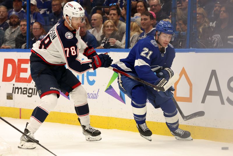 Apr 9, 2024; Tampa, Florida, USA; Columbus Blue Jackets defenseman Damon Severson (78) defends Tampa Bay Lightning center Brayden Point (21) during the first period at Amalie Arena. Mandatory Credit: Kim Klement Neitzel-USA TODAY Sports