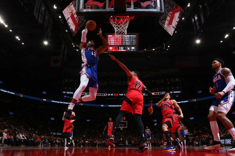 TORONTO, CANADA - MARCH 31: Tobias Harris #12 of the Philadelphia 76ers drives to the basket during the game against the Toronto Raptors on March 31, 2024 at the Scotiabank Arena in Toronto, Ontario, Canada.  NOTE TO USER: User expressly acknowledges and agrees that, by downloading and or using this Photograph, user is consenting to the terms and conditions of the Getty Images License Agreement.  Mandatory Copyright Notice: Copyright 2024 NBAE (Photo by Vaughn Ridley/NBAE via Getty Images)