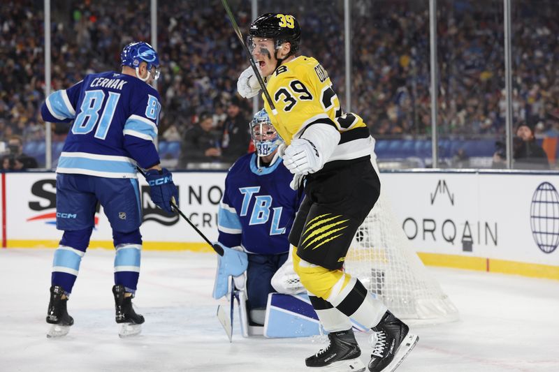 Feb 1, 2026; Tampa Bay, Florida, USA; Boston Bruins center Morgan Geekie (39) reacts after scoring a goal against the Tampa Bay Lightning during the first period in the 2026 Stadium Series ice hockey game at Raymond James Stadium. Mandatory Credit: Kim Klement Neitzel-Imagn Images