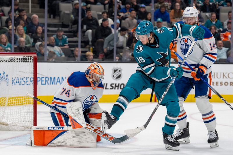 Dec 28, 2023; San Jose, California, USA; Edmonton Oilers goaltender Stuart Skinner (74) makes a save against San Jose Sharks center Jack Studnicka (16) during the second period at SAP Center at San Jose. Mandatory Credit: Neville E. Guard-USA TODAY Sports