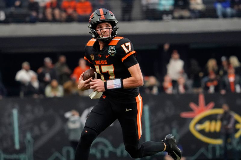 Dec 17, 2022; Las Vegas, NV, USA; Oregon State Beavers quarterback Ben Gulbranson (17) runs with the ball during the second half against the Florida Gators at the Las Vegas Bowl at Allegiant Stadium. Mandatory Credit: Lucas Peltier-USA TODAY Sports