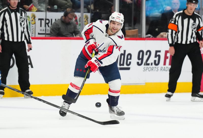 Jan 24, 2023; Denver, Colorado, USA; Washington Capitals left wing Conor Sheary (73) shoots the puck in the third period against the Colorado Avalanche at Ball Arena. Mandatory Credit: Ron Chenoy-USA TODAY Sports