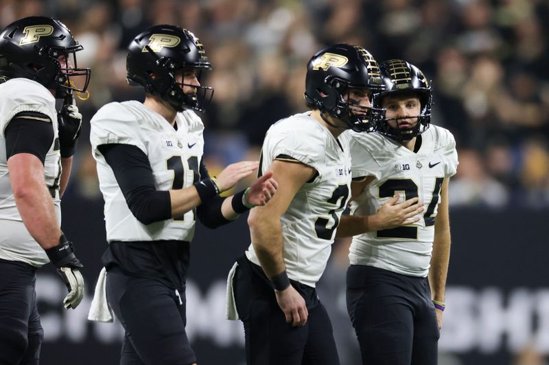 Dec 3, 2022; Indianapolis, Indiana, USA; Purdue Boilermakers place kicker Mitchell Fineran (24) celebrates his 45-yard field goal during the first half of the Big Ten Championship against the Michigan Wolverines at Lucas Oil Stadium. Mandatory Credit: Trevor Ruszkowski-USA TODAY Sports