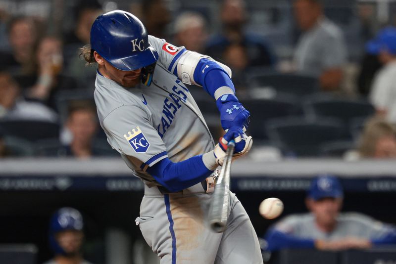 Sep 10, 2024; Bronx, New York, USA; Kansas City Royals shortstop Bobby Witt Jr. (7) hits an RBI single during the third inning against the New York Yankees at Yankee Stadium. Mandatory Credit: Vincent Carchietta-Imagn Images