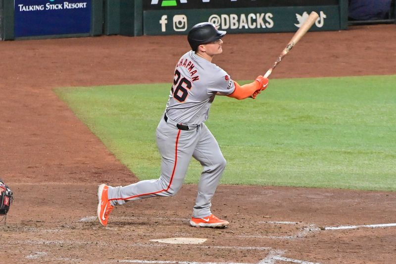 Sep 23, 2024; Phoenix, Arizona, USA;  San Francisco Giants third base Matt Chapman (26) hits a RBI triple in the seventh inning against the Arizona Diamondbacks at Chase Field. Mandatory Credit: Matt Kartozian-Imagn Images