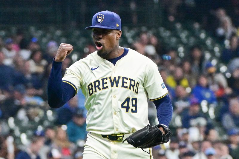 Apr 7, 2024; Milwaukee, Wisconsin, USA; Milwaukee Brewers pitcher Thyago Vieira (49) reacts after striking out Seattle Mariners designated hitter Mitch Garver (not pictured) in the eighth inning at American Family Field. Mandatory Credit: Benny Sieu-USA TODAY Sports