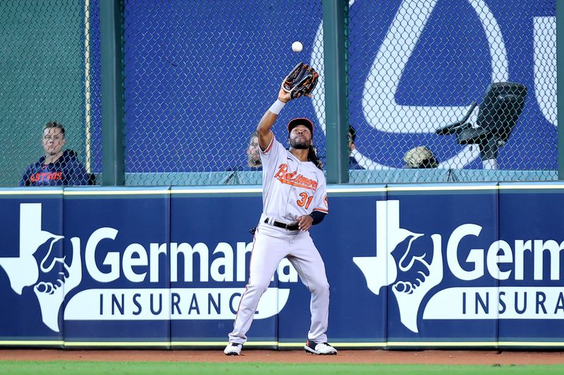 Sep 20, 2023; Houston, Texas, USA; Baltimore Orioles center fielder Cedric Mullins (31) catches a long fly ball hit by Houston Astros left fielder Chas McCormick (20, not shown) during the seventh inning at Minute Maid Park. Mandatory Credit: Erik Williams-USA TODAY Sports