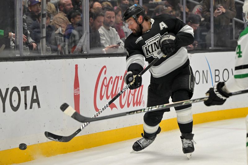 Jan 12, 2026; Los Angeles, California, USA;  Los Angeles Kings defenseman Drew Doughty (8) passes the puck in the first period against the Dallas Stars at Crypto.com Arena. Mandatory Credit: Jayne Kamin-Oncea-Imagn Images