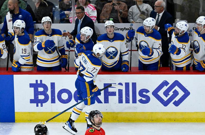 Oct 19, 2024; Chicago, Illinois, USA;  Buffalo Sabres right wing JJ Peterka (77) celebrates with teammates after scoring a goal against the Chicago Blackhawks during the second period at the United Center. Mandatory Credit: Matt Marton-Imagn Images