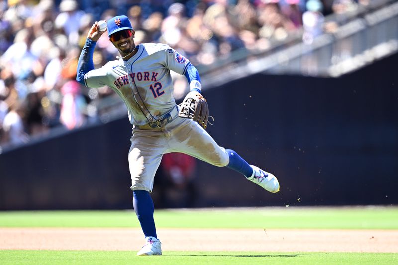 Aug 25, 2024; San Diego, California, USA; New York Mets shortstop Francisco Lindor (12) throws to first base during the fifth inning against the San Diego Padres at Petco Park. Mandatory Credit: Orlando Ramirez-USA TODAY Sports