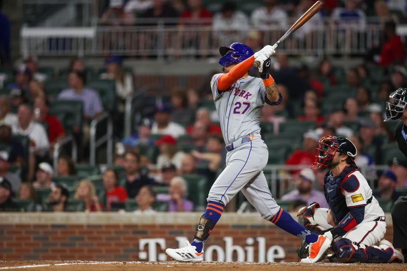 Sep 24, 2024; Atlanta, Georgia, USA; New York Mets third baseman Mark Vientos (27) hits a home run against the Atlanta Braves in the seventh inning at Truist Park. Mandatory Credit: Brett Davis-Imagn Images
