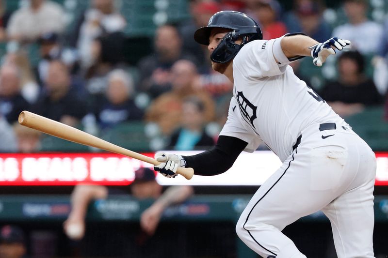 Jul 10, 2024; Detroit, Michigan, USA;  Detroit Tigers catcher Jake Rogers (34) hits a double in the second inning against the Cleveland Guardians at Comerica Park. Mandatory Credit: Rick Osentoski-USA TODAY Sports