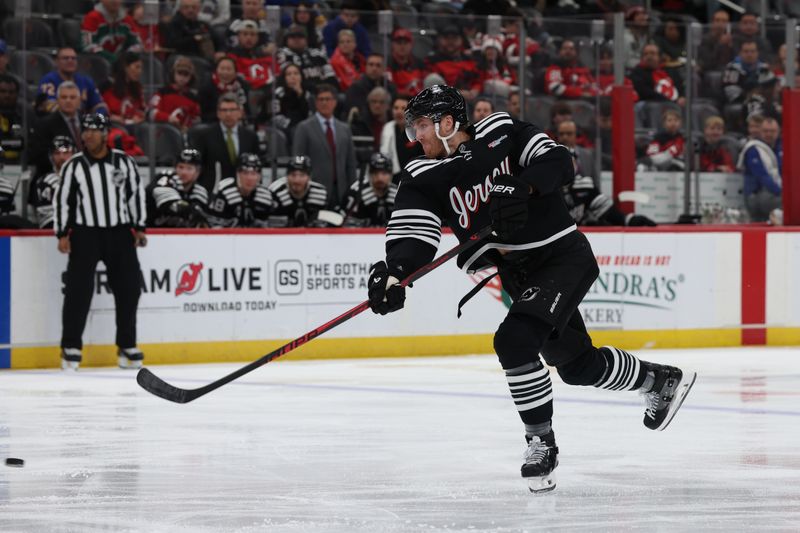 Dec 21, 2025; Newark, New Jersey, USA;  New Jersey Devils defenseman Dougie Hamilton (7) takes a shot against the Buffalo Sabres during the second period at Prudential Center. Mandatory Credit: Thomas Salus-Imagn Images
