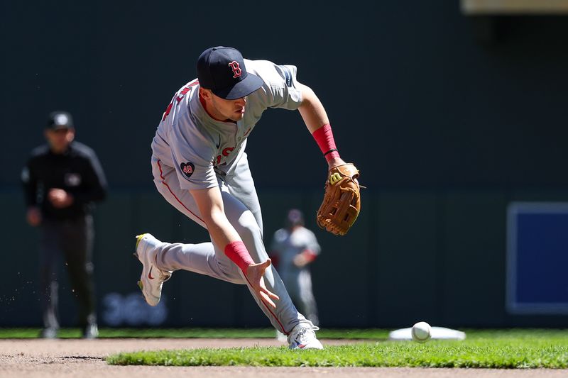 May 5, 2024; Minneapolis, Minnesota, USA; Boston Red Sox third baseman Zack Short (18) fields the ball hit by Minnesota Twins Max Kepler (26) during the second inning at Target Field. Mandatory Credit: Matt Krohn-USA TODAY Sports