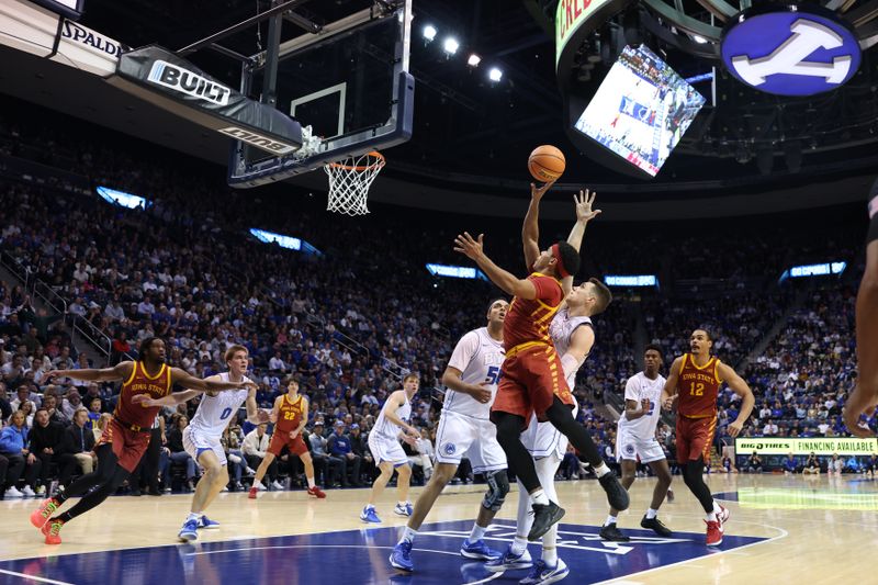 Jan 16, 2024; Provo, Utah, USA; Iowa State Cyclones guard Tamin Lipsey (3) drives to the basket against Brigham Young Cougars guard Spencer Johnson (20) during the second half at Marriott Center. Mandatory Credit: Rob Gray-USA TODAY Sports