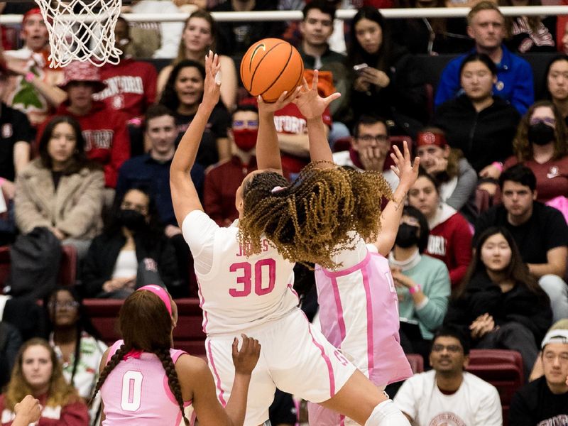 Feb 17, 2023; Stanford, California, USA;  Stanford Cardinal guard Haley Jones (30) shoots over USC Trojans forward Koi Love (0) during the first half at Maples Pavilion. Mandatory Credit: John Hefti-USA TODAY Sports