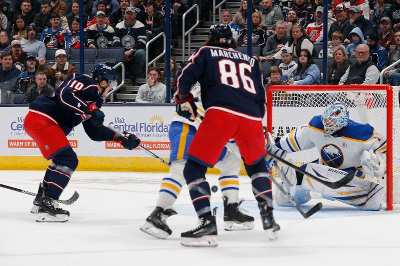 Feb 23, 2024; Columbus, Ohio, USA; Columbus Blue Jackets left wing Dmitri Voronkov (10) scores a goal against the Buffalo Sabres during the first period at Nationwide Arena. Mandatory Credit: Russell LaBounty-USA TODAY Sports