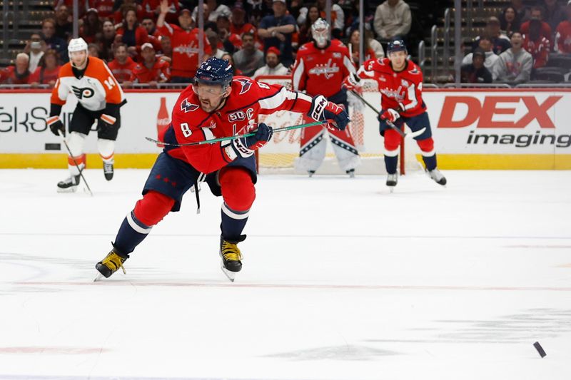 Oct 23, 2024; Washington, District of Columbia, USA; Washington Capitals left wing Alex Ovechkin (8) chases a loose puck en route to scoring an empty net goal against the Philadelphia Flyers in the third period at Capital One Arena. Mandatory Credit: Geoff Burke-Imagn Images