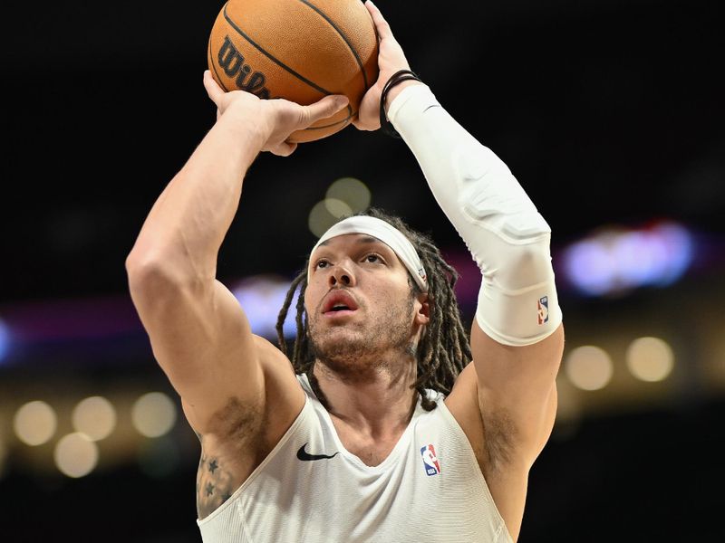 PORTLAND, OREGON - MARCH 23: Aaron Gordon #50 of the Denver Nuggets warms up before the game against the Portland Trail Blazers at the Moda Center on March 23, 2024 in Portland, Oregon. NOTE TO USER: User expressly acknowledges and agrees that, by downloading and or using this photograph, User is consenting to the terms and conditions of the Getty Images License Agreement. (Photo by Alika Jenner/Getty Images)