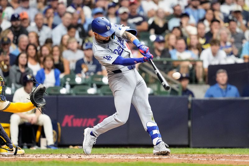 Aug 13, 2024; Milwaukee, Wisconsin, USA;  Los Angeles Dodgers center fielder Andy Pages (44) hits a home run during the fourth inning against the Milwaukee Brewers at American Family Field. Mandatory Credit: Jeff Hanisch-USA TODAY Sports