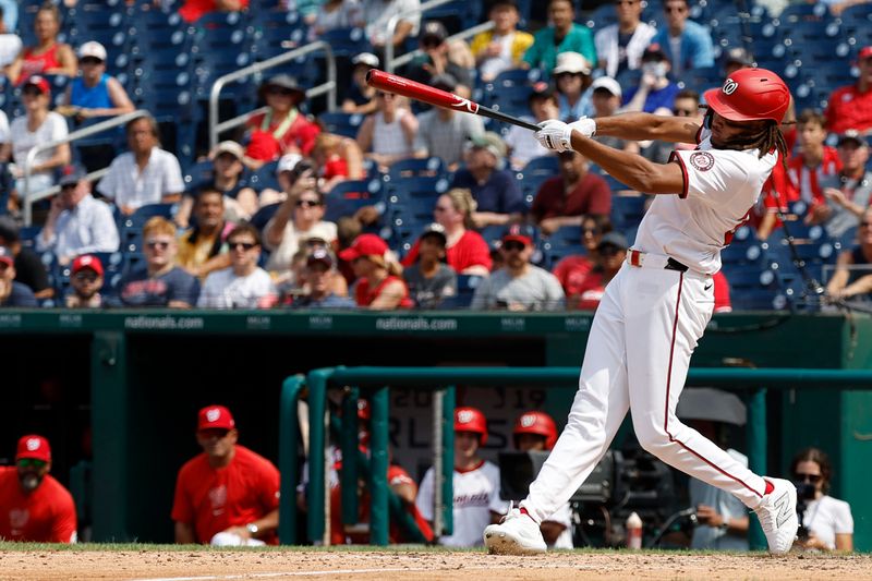 Jul 21, 2024; Washington, District of Columbia, USA; Washington Nationals outfielder James Wood (29) hits a go ahead three run home run against the Cincinnati Reds during the eighth inning at Nationals Park. Mandatory Credit: Geoff Burke-USA TODAY Sports