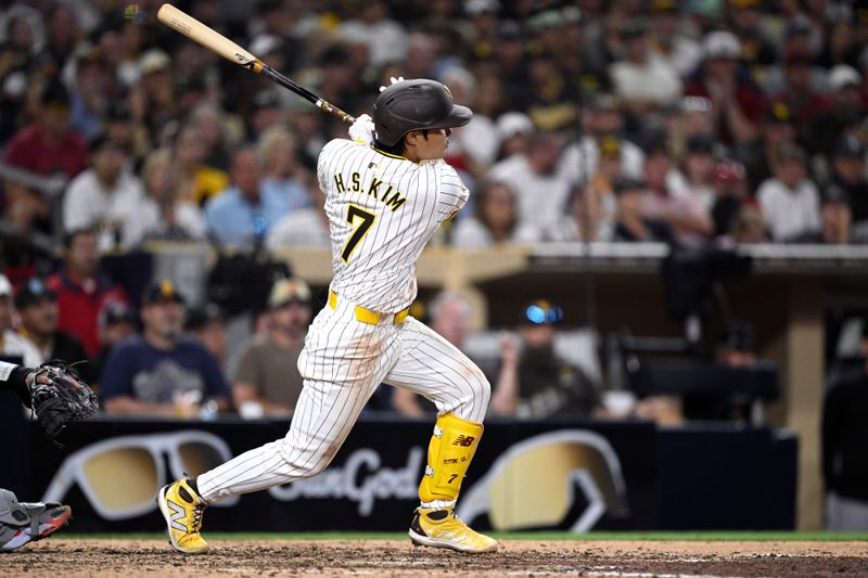 Jul 6, 2024; San Diego, California, USA; San Diego Padres shortstop Ha-Seong Kim (7) hits an RBI double against the Arizona Diamondbacks during the eighth inning at Petco Park. Mandatory Credit: Orlando Ramirez-USA TODAY Sports