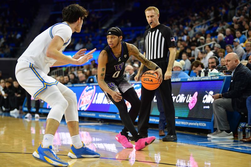 January 14, 2024; Los Angeles, California, USA; Washington Huskies guard Koren Johnson (0) moves the ball against UCLA Bruins guard Lazar Stefanovic (10) during the first half at Pauley Pavilion. Mandatory Credit: Gary A. Vasquez-USA TODAY Sports