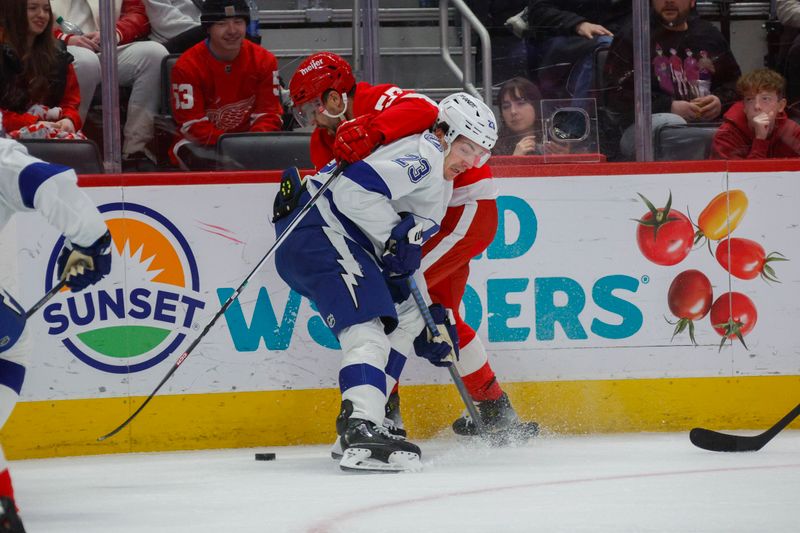 Jan 21, 2024; Detroit, Michigan, USA; Tampa Bay Lightning center Michael Eyssimont (23) fights for control of the puck with Detroit Red Wings left wing David Perron (57) during the first period at Little Caesars Arena. Mandatory Credit: Brian Bradshaw Sevald-USA TODAY Sports