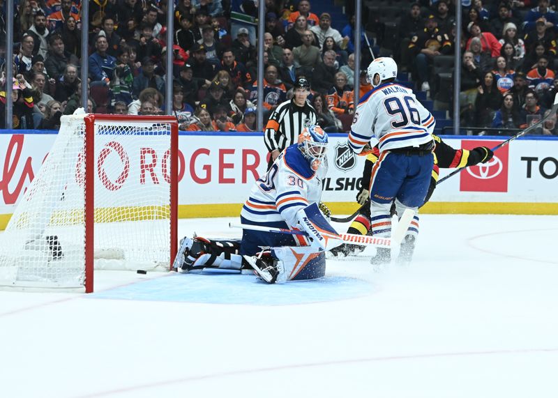 Oct 26, 2025; Vancouver, British Columbia, CAN; Vancouver Canucks left wing Kiefer Sherwood (44) scores goal against Edmonton Oilers goaltender Calvin Pickard (30) at Rogers Arena. Mandatory Credit: Simon Fearn-Imagn Images