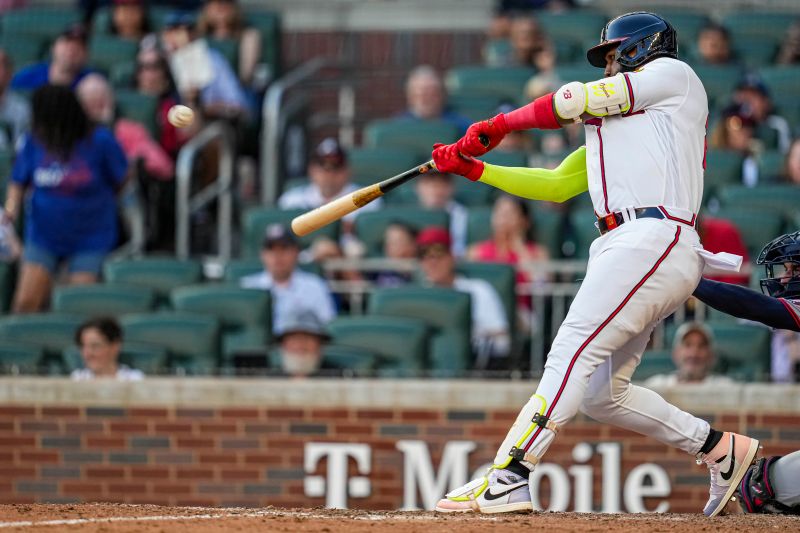 Oct 1, 2023; Cumberland, Georgia, USA; Atlanta Braves designated hitter Marcell Ozuna (20) hits a home run against the Washington Nationals to tie the Major League team record for home runs hit in a season during the ninth inning at Truist Park. Mandatory Credit: Dale Zanine-USA TODAY Sports