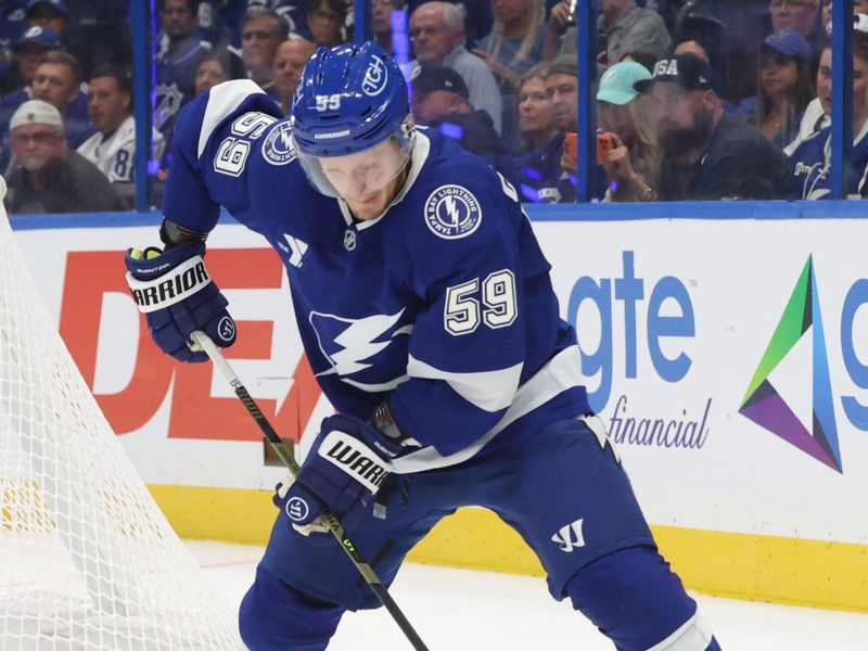 Oct 9, 2025; Tampa, Florida, USA; Tampa Bay Lightning center Jake Guentzel (59) skates with the puck against the Ottawa Senators  during the first period at Benchmark International Arena. Mandatory Credit: Kim Klement Neitzel-Imagn Images