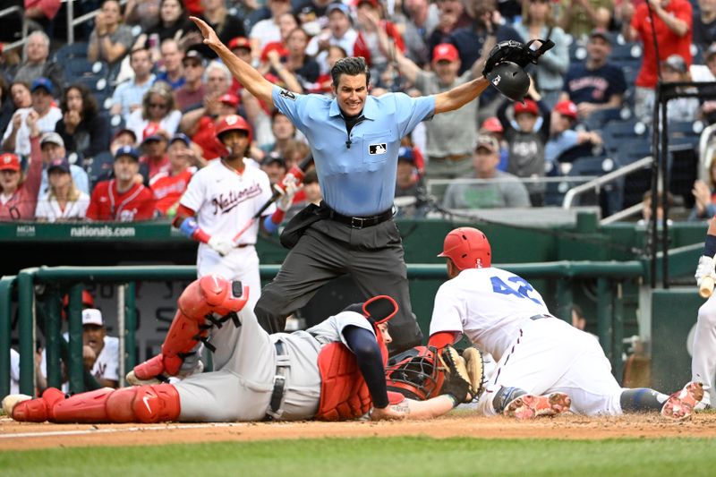 Apr 15, 2023; Washington, District of Columbia, USA; /Washington Nationals second baseman Luis Garcia (2) beat the tag attempt by Cleveland Guardians catcher Cam Gallagher (35) to score during the fourth inning at Nationals Park. Mandatory Credit: Brad Mills-USA TODAY Sports