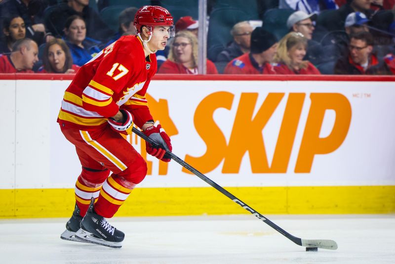 Jan 18, 2024; Calgary, Alberta, CAN; Calgary Flames center Yegor Sharangovich (17) controls the puck against the Toronto Maple Leafs during the first period at Scotiabank Saddledome. Mandatory Credit: Sergei Belski-USA TODAY Sports