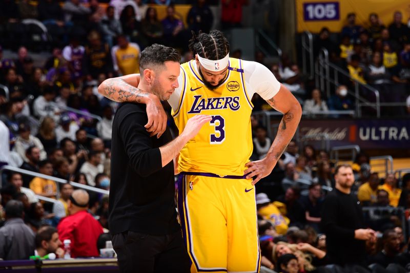 LOS ANGELES, CA - NOVEMBER 8: Anthony Davis #3 and Head Coach JJ Redick of the Los Angeles Lakers talk during the game= against the Philadelphia 76ers on Novemberr 8, 2024 at Crypto.Com Arena in Los Angeles, California. NOTE TO USER: User expressly acknowledges and agrees that, by downloading and/or using this Photograph, user is consenting to the terms and conditions of the Getty Images License Agreement. Mandatory Copyright Notice: Copyright 2024 NBAE (Photo by Adam Pantozzi/NBAE via Getty Images)