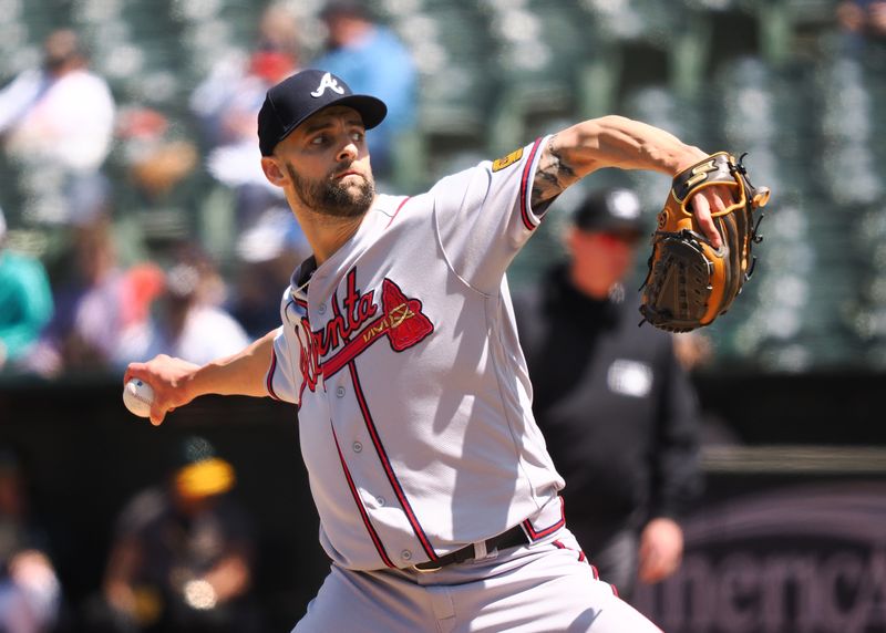 May 31, 2023; Oakland, California, USA; Atlanta Braves relief pitcher Nick Anderson (61) pitches the ball against the Oakland Athletics during the eighth inning at Oakland-Alameda County Coliseum. Mandatory Credit: Kelley L Cox-USA TODAY Sports