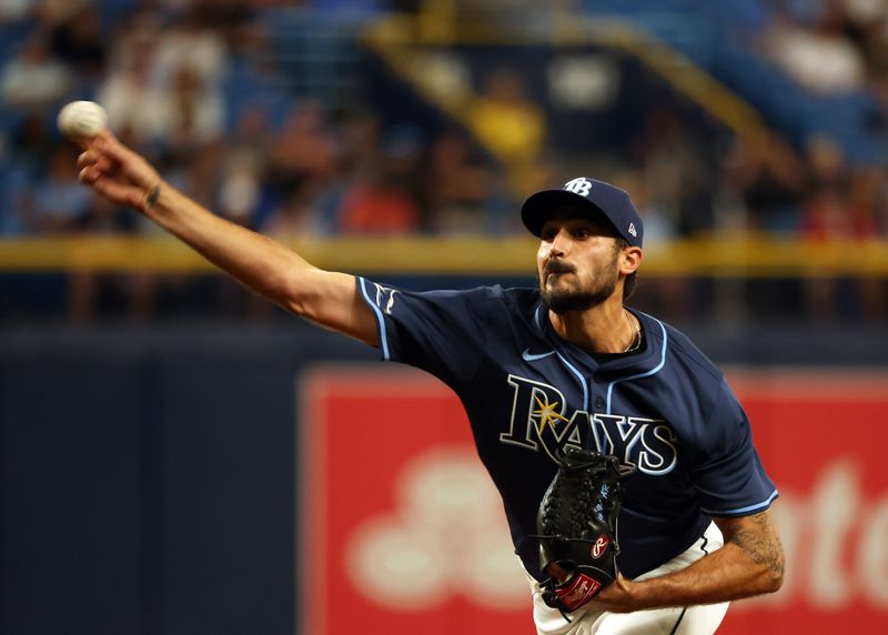 Apr 2, 2024; St. Petersburg, Florida, USA; Tampa Bay Rays starting pitcher Zach Eflin (24) throws a pitch during the second inning against the Texas Rangers at Tropicana Field. Mandatory Credit: Kim Klement Neitzel-USA TODAY Sports