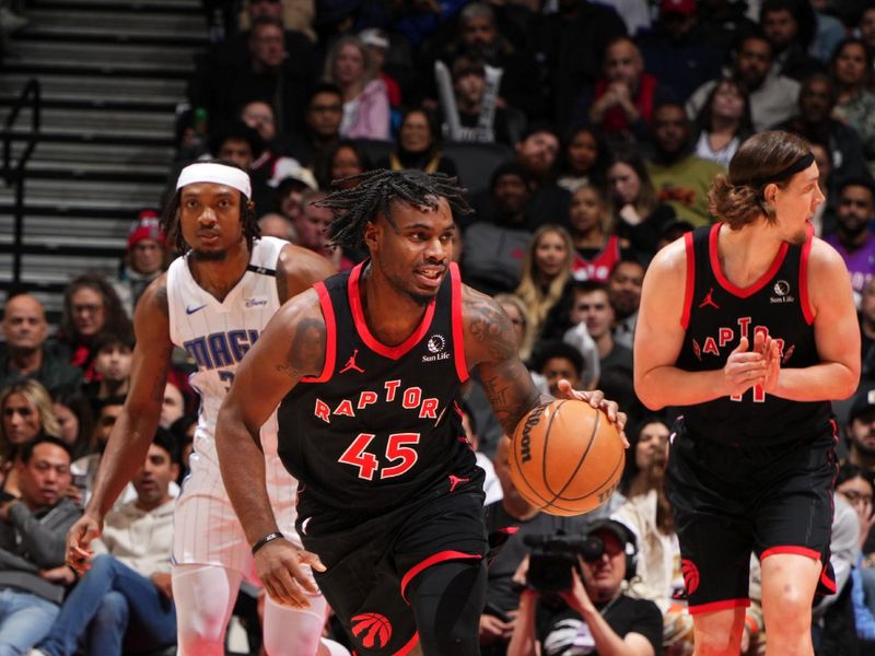 TORONTO, CANADA - JANUARY 3: Davion Mitchell #45 of the Toronto Raptors brings the ball up court during the game against the Orlando Magic on January 3, 2025 at the Scotiabank Arena in Toronto, Ontario, Canada.  NOTE TO USER: User expressly acknowledges and agrees that, by downloading and or using this Photograph, user is consenting to the terms and conditions of the Getty Images License Agreement.  Mandatory Copyright Notice: Copyright 2025 NBAE(Photo by Mark Blinch/NBAE via Getty Images)