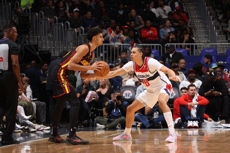 WASHINGTON, DC -? OCTOBER 30: Kyshawn George #18 of the Washington Wizards plays defense during the game against the Atlanta Hawks during a regular season game on October 30, 2024 at Capital One Arena in Washington, DC. NOTE TO USER: User expressly acknowledges and agrees that, by downloading and or using this Photograph, user is consenting to the terms and conditions of the Getty Images License Agreement. Mandatory Copyright Notice: Copyright 2024 NBAE (Photo by Kenny Giarla/NBAE via Getty Images)