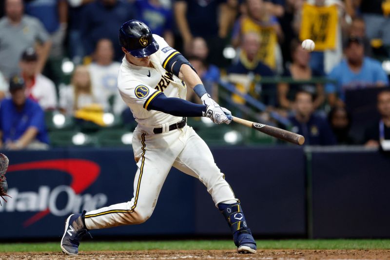 Oct 4, 2023; Milwaukee, Wisconsin, USA; Milwaukee Brewers player Mark Canha (21) hits a single in eighth inning against the Arizona Diamondbacks during game two of the Wildcard series for the 2023 MLB playoffs at American Family Field. Mandatory Credit: Kamil Krzaczynski-USA TODAY Sports