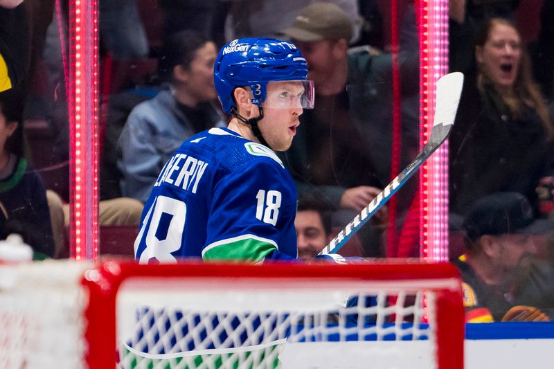 Dec 9, 2023; Vancouver, British Columbia, CAN; Vancouver Canucks forward Sam Lafferty (18) celebrates his goal against the Carolina Hurricanes in the first period at Rogers Arena. Mandatory Credit: Bob Frid-USA TODAY Sports