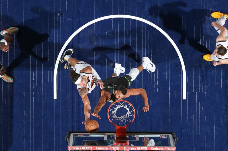 MINNEAPOLIS, MN -  NOVEMBER 1: Rudy Gobert #27 of the Minnesota Timberwolves block during the game against the Denver Nuggets on November 1, 2024 at Target Center in Minneapolis, Minnesota. NOTE TO USER: User expressly acknowledges and agrees that, by downloading and or using this Photograph, user is consenting to the terms and conditions of the Getty Images License Agreement. Mandatory Copyright Notice: Copyright 2024 NBAE (Photo by David Sherman/NBAE via Getty Images)