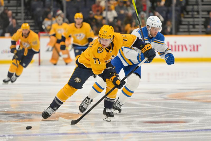 Dec 11, 2025; Nashville, Tennessee, USA;  Nashville Predators right wing Luke Evangelista (77) skates with the puck against the St. Louis Blues during the first period at Bridgestone Arena. Mandatory Credit: Steve Roberts-Imagn Images