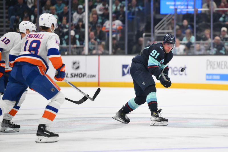 Nov 16, 2024; Seattle, Washington, USA; Seattle Kraken right wing Daniel Sprong (91) passes the puck during the first period against the New York Islanders at Climate Pledge Arena. Mandatory Credit: Steven Bisig-Imagn Images